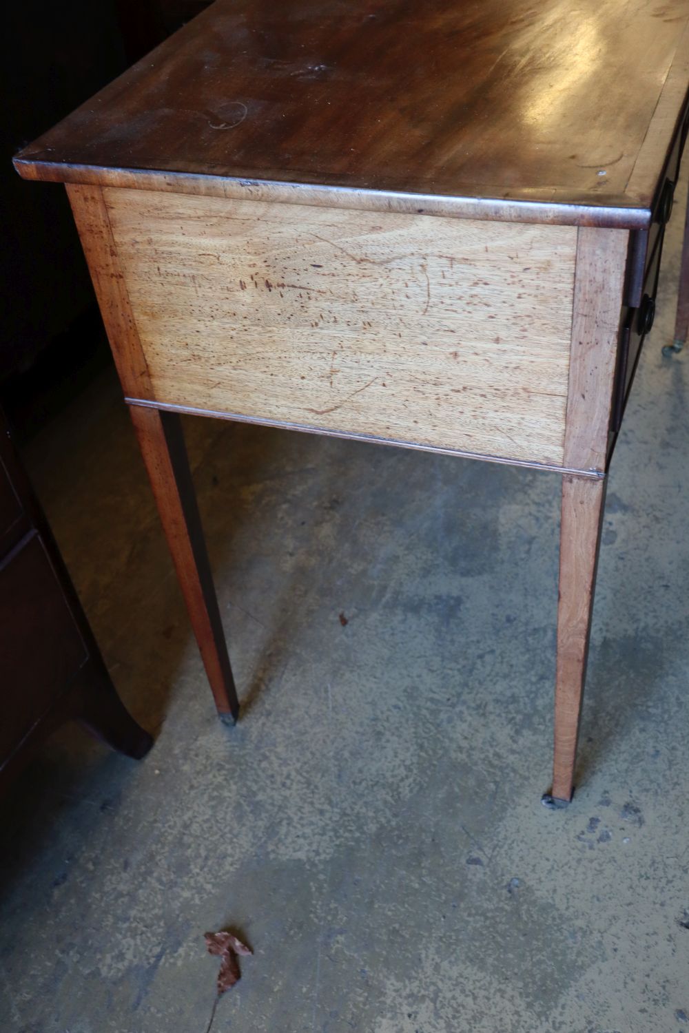 A George III mahogany dressing table, with crossbanded and five small drawers, width 107cm